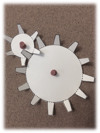 Photograph of two paper gears.