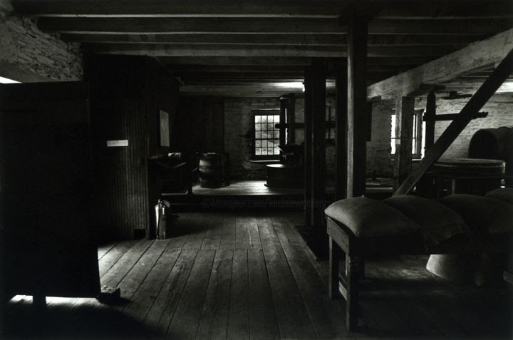 Black and white photograph of the first floor of Peirce Mill