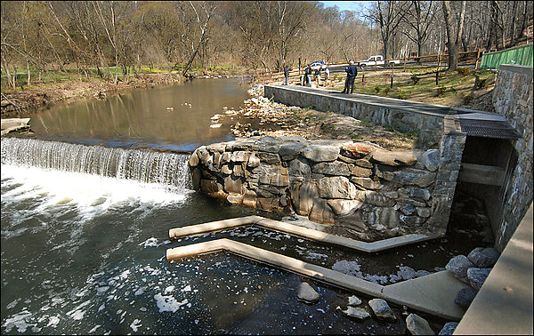 A concrete canal, or fish ladder, next to the waterfall at Peirce Mill