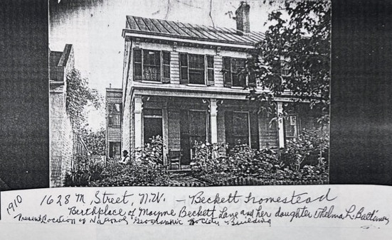 Page from an old album showing a home with a front porch and shutters.
