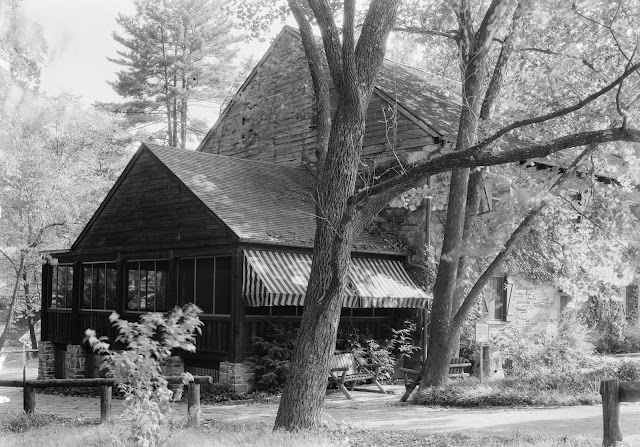 Black and white photograph of Peirce Mill with an addition built on the side of the building where the waterwheel once turned.