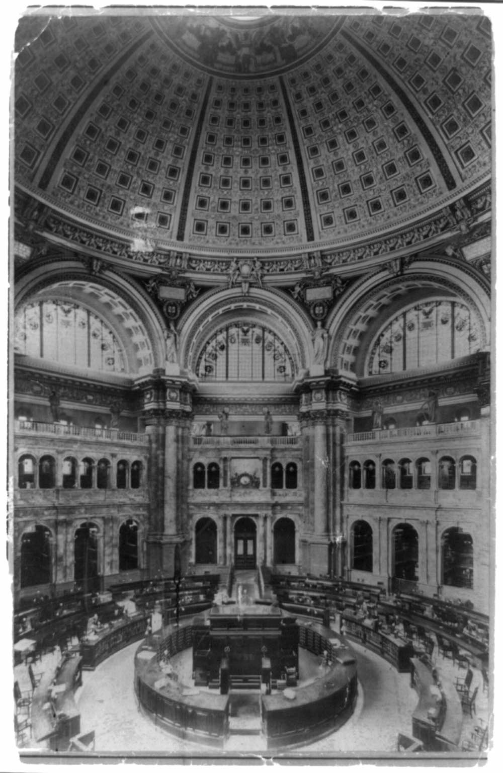 Photograph of a cavernous library room with a coffered ceiling