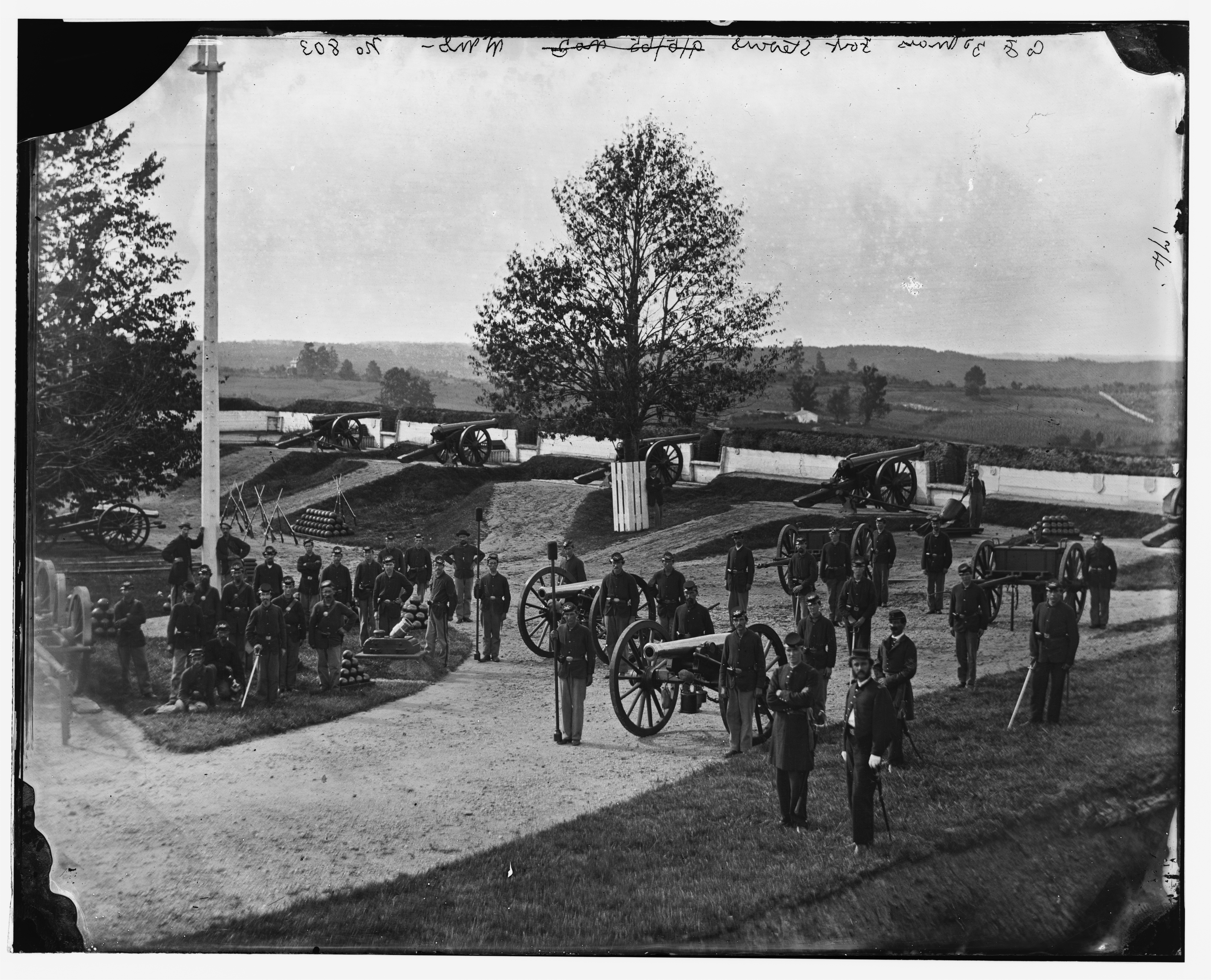 Photograph of soldiers standing in front of a fort during the Civil War.