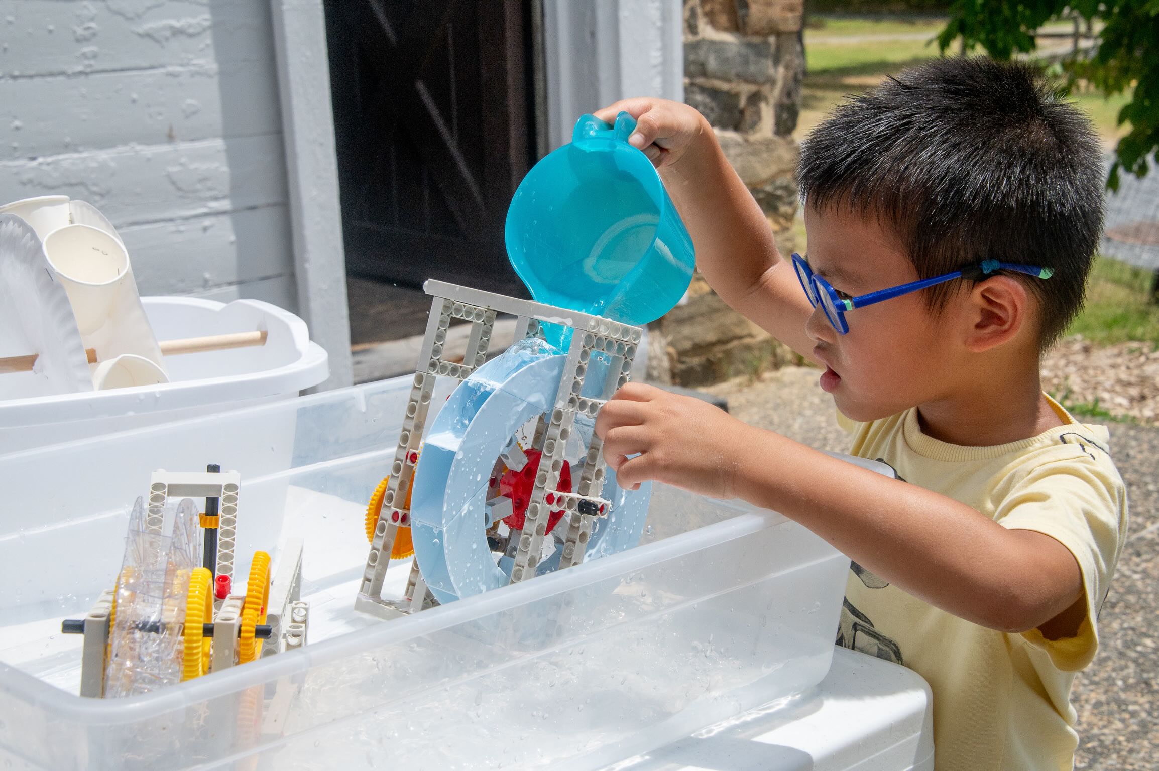 Child experimenting with water toys
